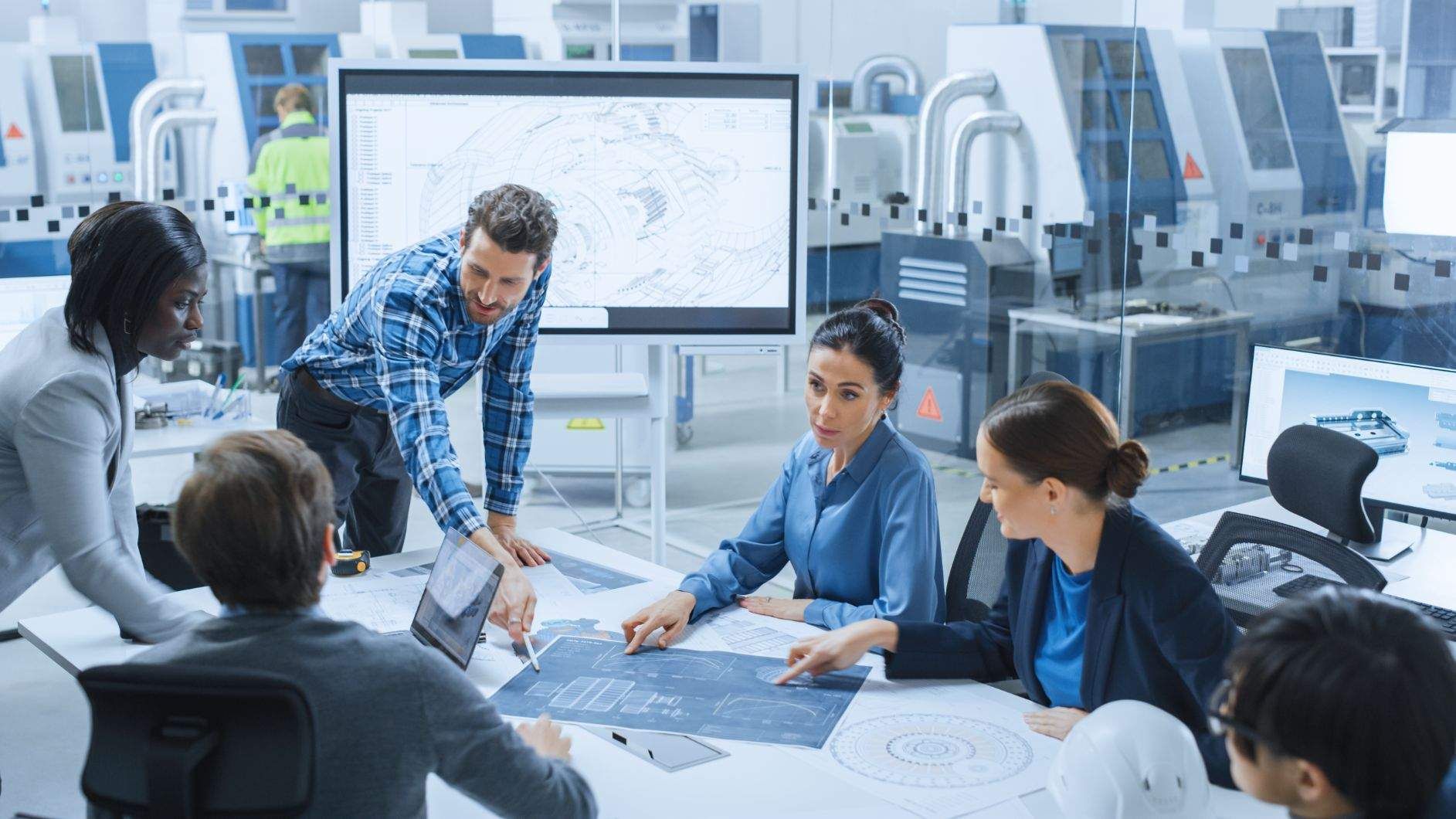 Workers around a table in an office